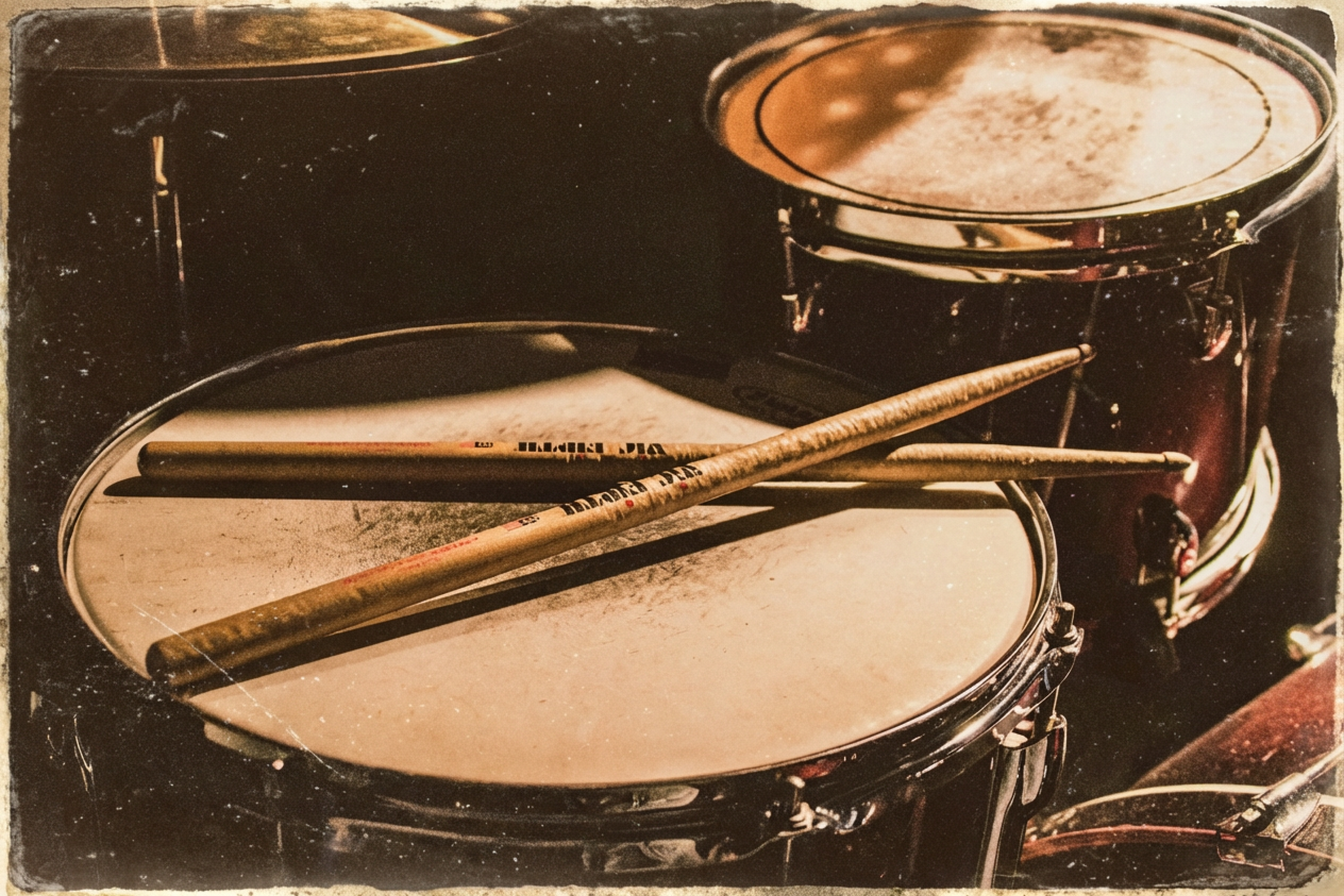 Close-up of a snare drum with drumsticks